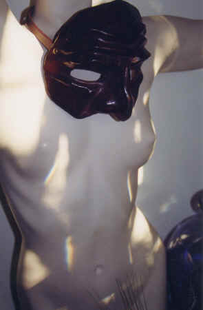 Bridgit tries on one of  Dana's masks, Berkeley, 1999 copyright Pam Mendelsohn